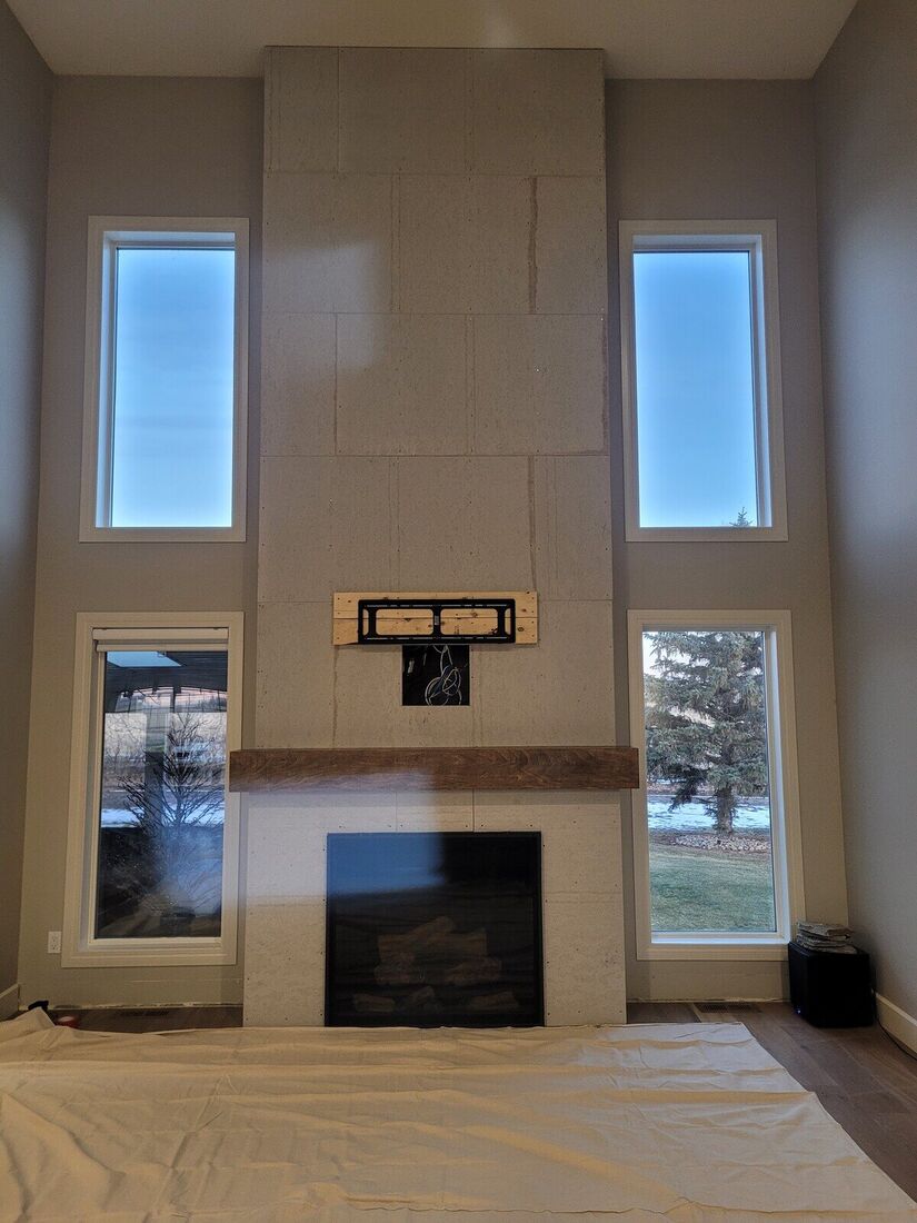 Two-storey fireplace wall in cement board before stone
