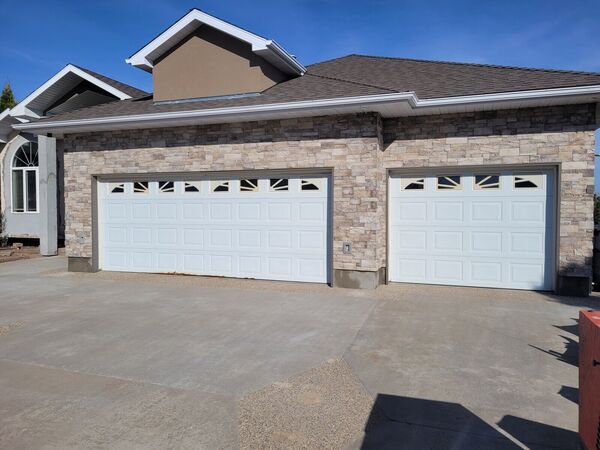 Stone and stucco garage front